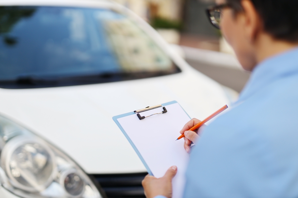 inspecting car